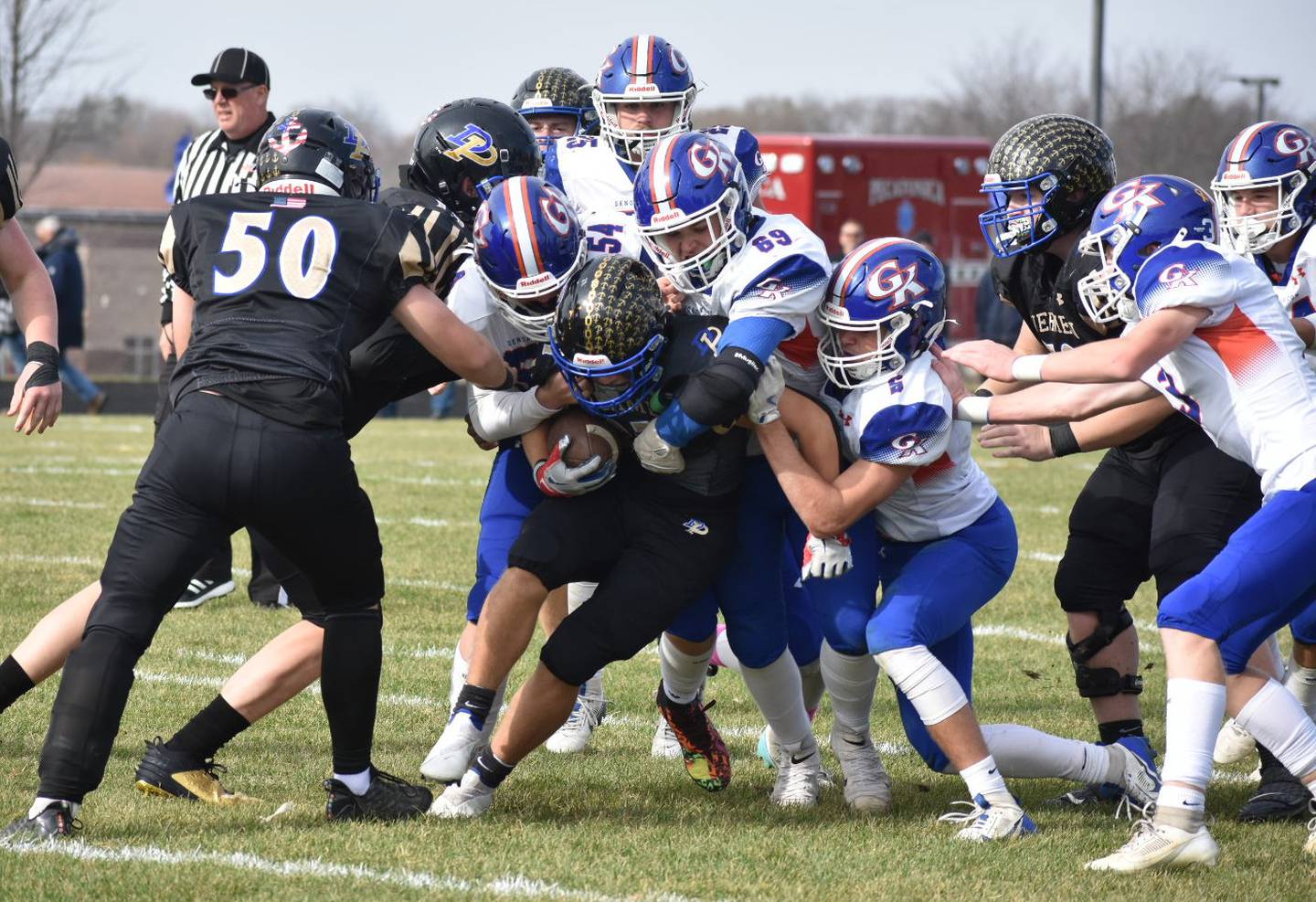 The Genoa-Kingston defense swarms to the ball against Durand-Pecatonica on Saturday, November 2, 2024, in a Class 3A first-round playoff game.
