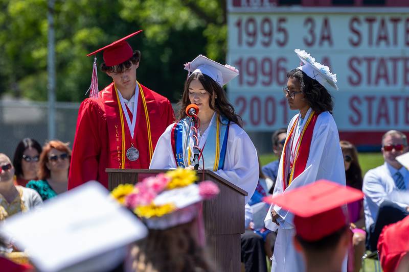 (left to right) Jack Jablonski, Morgan Hoscheid, and Bella Templeton speak at graduation ceremony on Sunday, May 18, 2025 at Hall High School in Spring Valley.