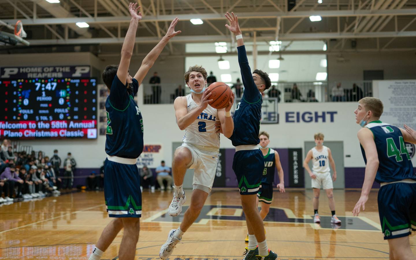 Burlington Central's Gavin Sarvis (2) drives to the basket against Peoria Notre Dame during the Plano Christmas Classic Championship at Plano High School on Thursday, Dec 30, 2021.