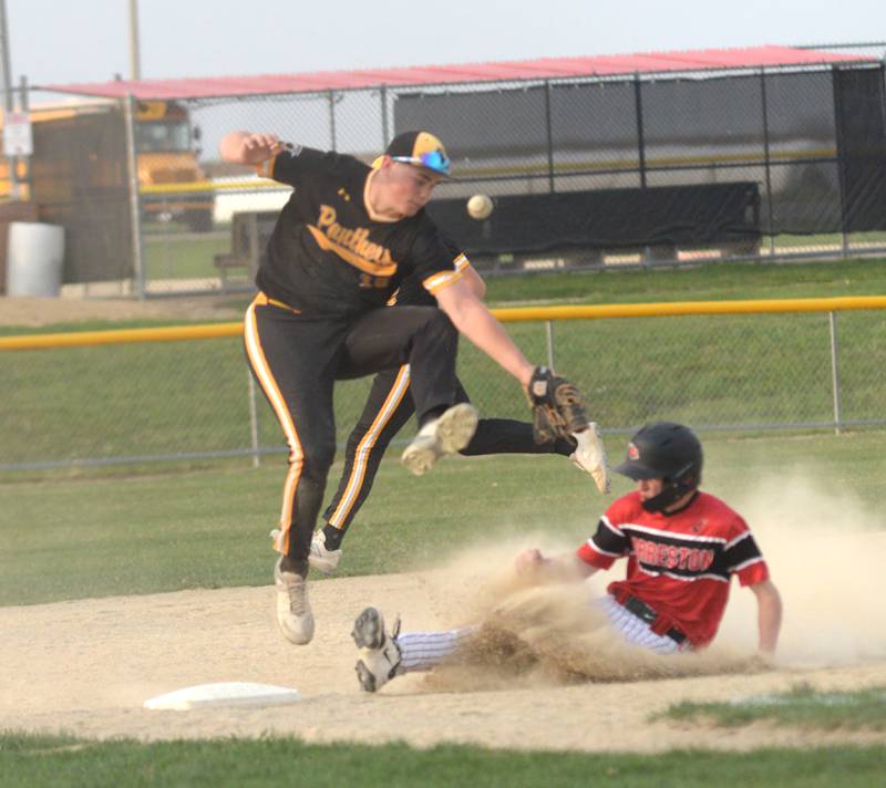 Forreston's Brady Gill slides under a throw to third base during a Monday, April 28, 2025 game with Lena-Winslow at Forreston High School.