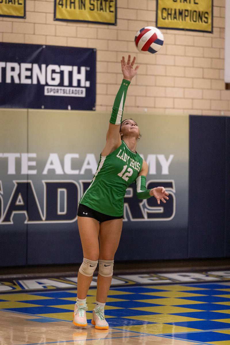 Seneca High Schools Lexie Buis serves the ball during the match against Marquette at Bader Gym on September 25, 2025 at Marquette High School.