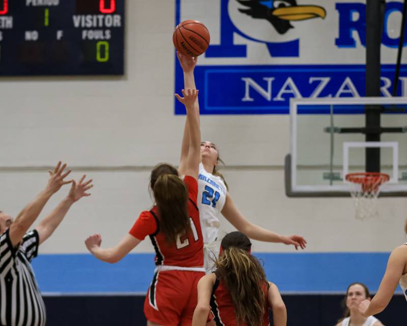 Nazareth's Olivia Austin (21) tips off with Deerfield's Olivia Kerndt (21) at the start of their varsity basketball game versus Deerfield. Jan 23, 2023.