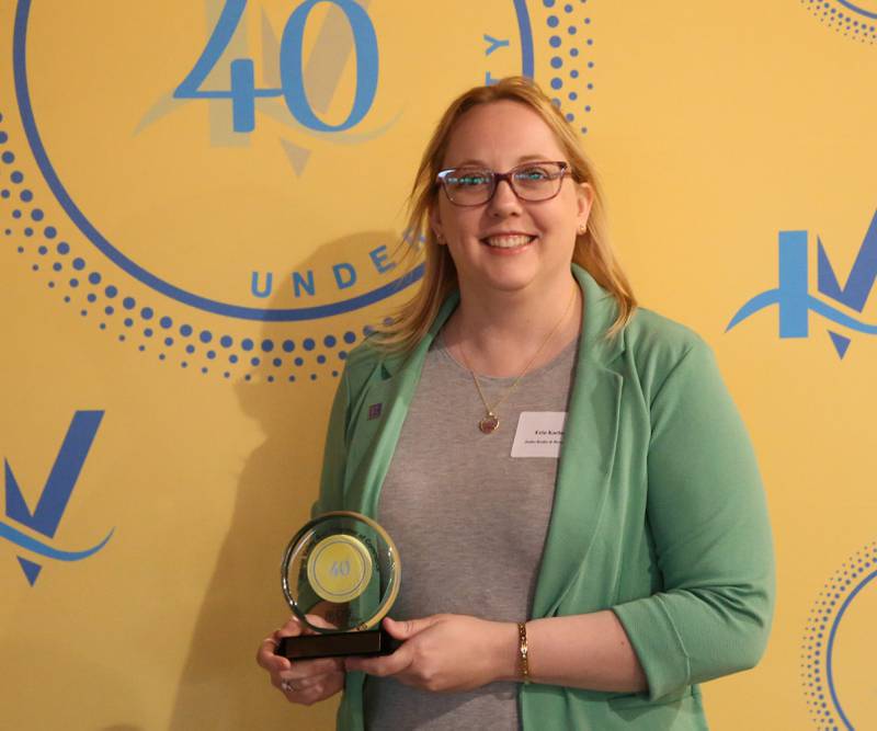 Erin Karlosky poses for a photo with her award during the 40 Under Forty awards banquet on Thursday, March 21, 2024 at Westclox in Peru.