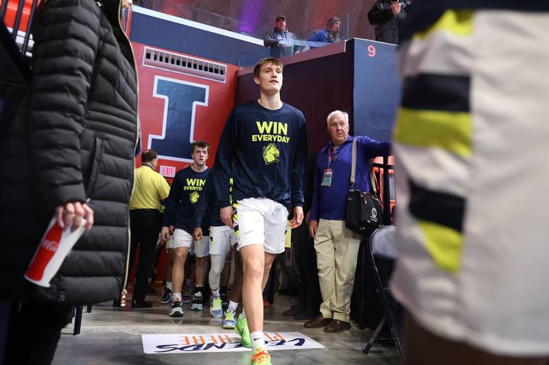 Yorkville Christian’s Jaden Schutt and the rest of the Mustangs enter the arena against Liberty in the Class 1A championship game at State Farm Center in Champaign. Friday, Mar. 11, 2022, in Champaign.