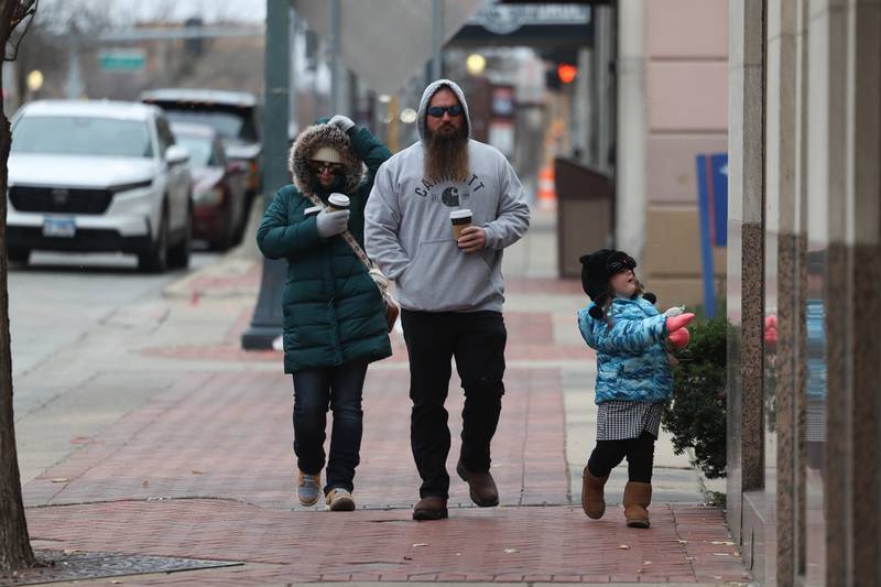 A family made a hot chocolate stop at Jitters before heading to the festivities at the Joliet Light Up the Lights Holiday Festival on Friday, Nov. 29, 2024.