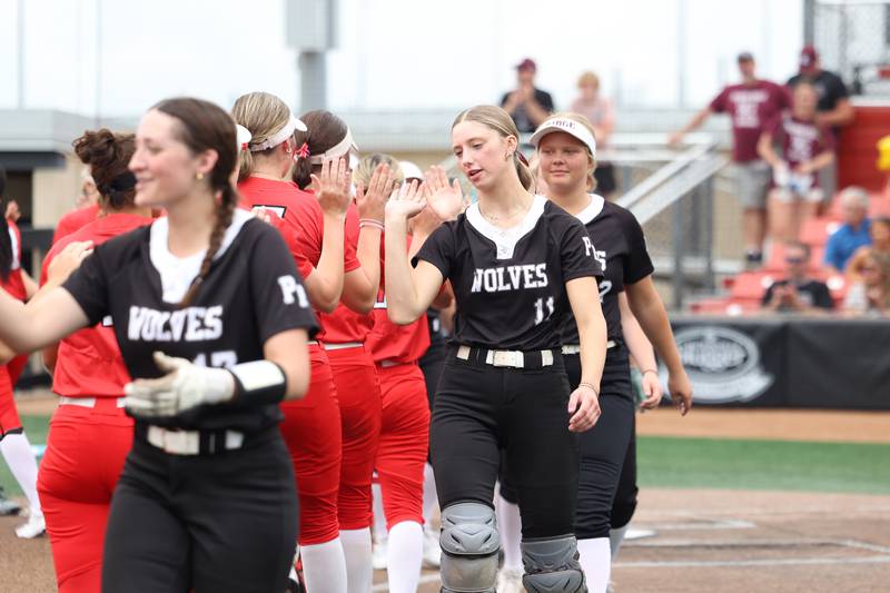 Prairie Ridge's Kendra Carroll high fives Glenwood players following the Wolves' 5-0 loss to Glenwood in the IHSA Class 3A state semifinal on June 13, 2025.