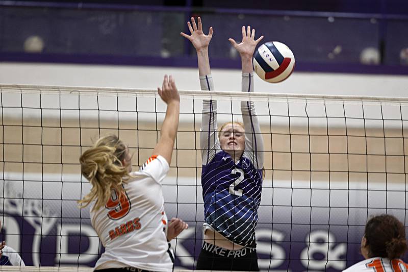 Dixon’s Madyson Tichler goes up to block a shot against DeKalb’s Isabelle Smith Tuesday, Sept. 5, 2023 in a game at Dixon High School.