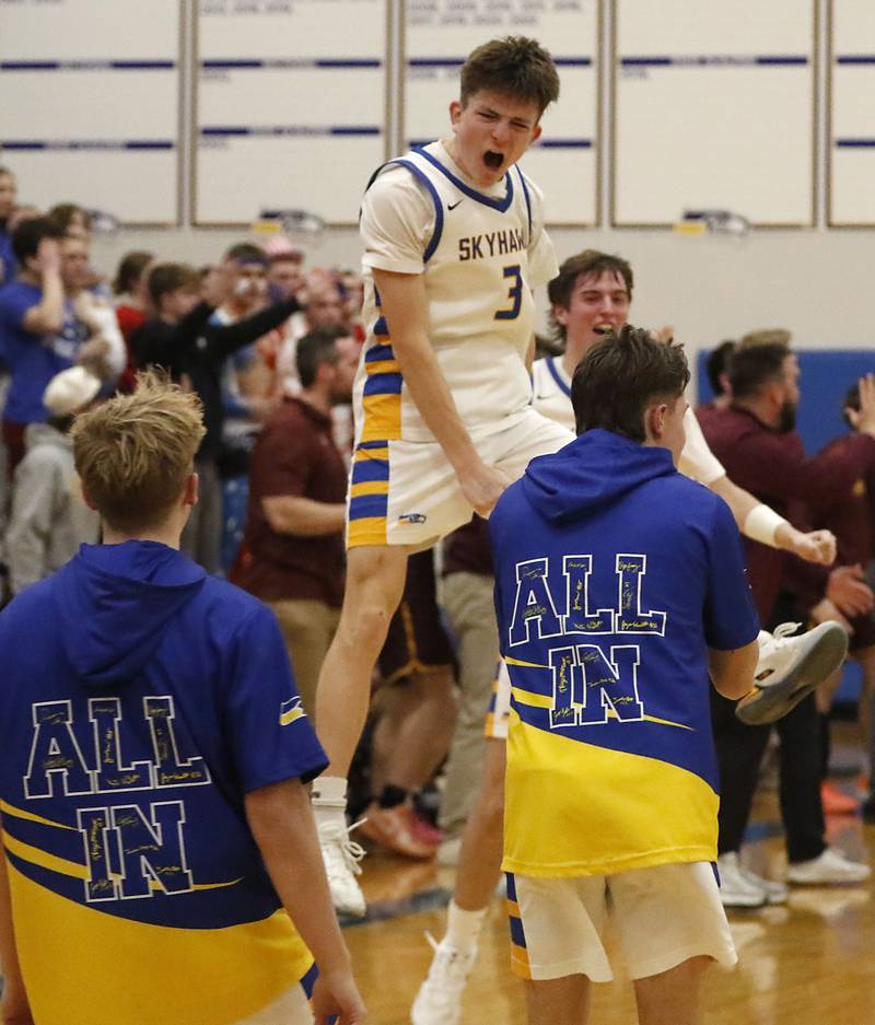 Johnsburg's Trey Toussaint celebrates after defeating Richmond-Burton to win  the IHSA Class 2A Johnsburg Regional Championship boys basketball game on Friday, February, 27, 2026, at Johnsburg High School.