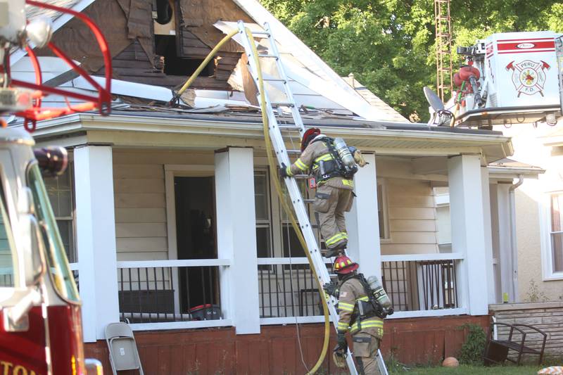Firefighters work the scene of a structure fire in the 300 block of West Erie Street on Thursday, Aug. 28, 2025 in Spring Valley. The fire happened shortly after 4:45p.m. A Mutual Aid Box Alarm System was set out when firefighters arrived. Fire departments from Princeton, Spring Valley, Peru, Ladd, Cherry, Standard and La Salle were on the scene. Peru and Spring Valley EMS were also dispatched. Spring Valley Police assisted on the call as well.