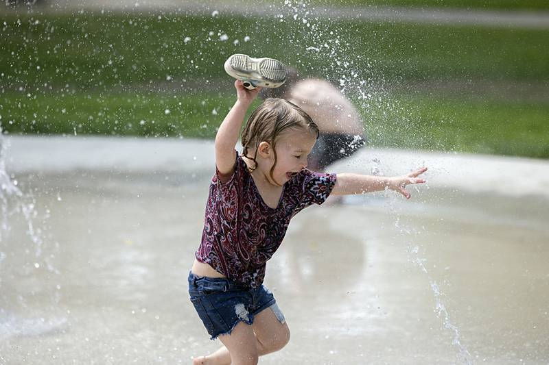 Rebecca Bellows, 3, runs through the water at Sterling’s new splash pad at the Grandon Civic Center Wednesday, May 31, 2023. The new pad is open 9 a.m. to 8 p.m. except on days of a Municipal Band concert.