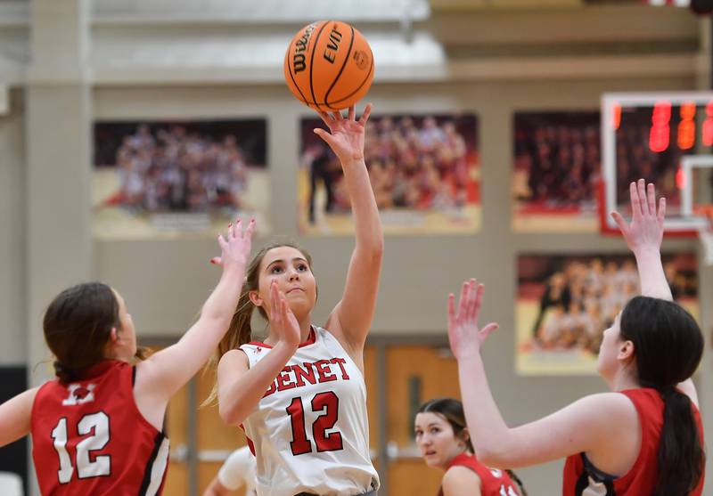 Benet’s Lindsay Harzich lays the ball up during a game against Marist on January 8, 2025 at Benet Academy in Lisle.