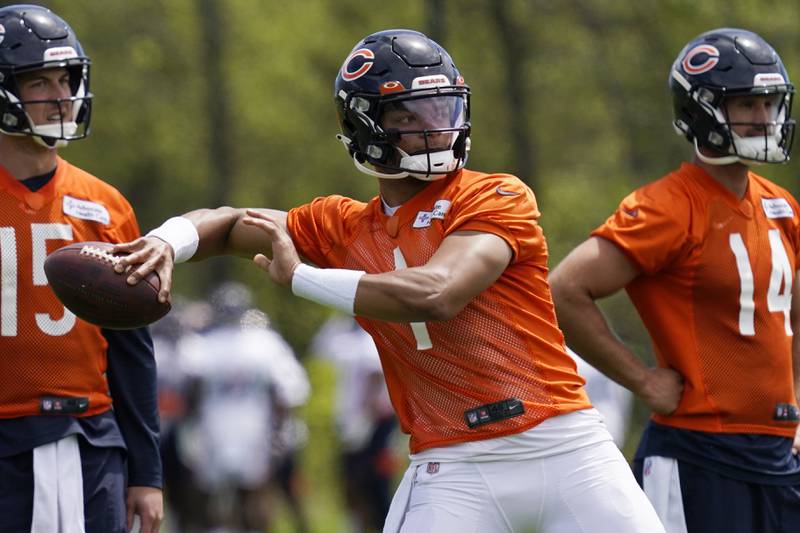 Chicago Bears quarterback Justin Fields throws a pass during practice, Wednesday, May 17, 2022, at Halas Hall in Lake Forest.