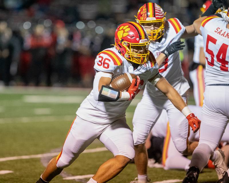 Batavia's Preston Brummel runs the ball for a gain against Glenbard East at the Class 7 A Second Round playoff game on Friday, Nov. 7,2025 in Lombard.