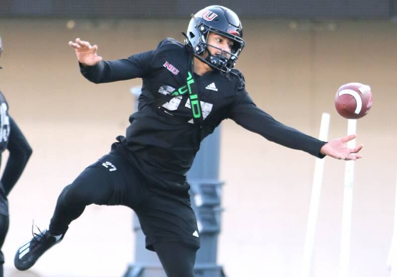 Northern Illinois University safety Trey Porter tries to catch a tipped pass during a drill at spring practice Friday, April 7, 2023, in Huskie Stadium at NIU in DeKalb.