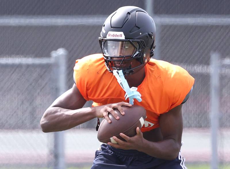 DeKalb’s Davon Grant catches a pass Wednesday, July 15, 2025, during a summer practice session at the school.