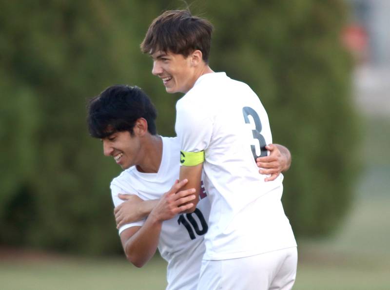 Prairie Ridge’s Trenton Pavoris, right, and  Mateo Torres celebrate the Wolves’ second goal in varsity soccer at Jacobs High School in Algonquin on Thursday, Sept. 18, 2025.