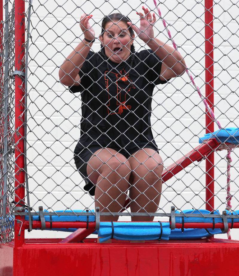 DeKalb Police Officer and Huntley Middle School student resource officer Danielle Sorenson takes a dip in the dunk tank Tuesday, Aug. 6, 2024, during National Night Out in the Hy-Vee parking lot in Sycamore.