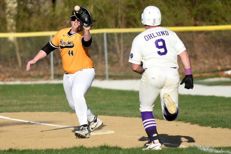Herscher's Nash Brubaker, left, fields a throw at first base ahead of Wilmington's Zach Ohlund during a game at Wilmington Tuesday, April 7, 2026.