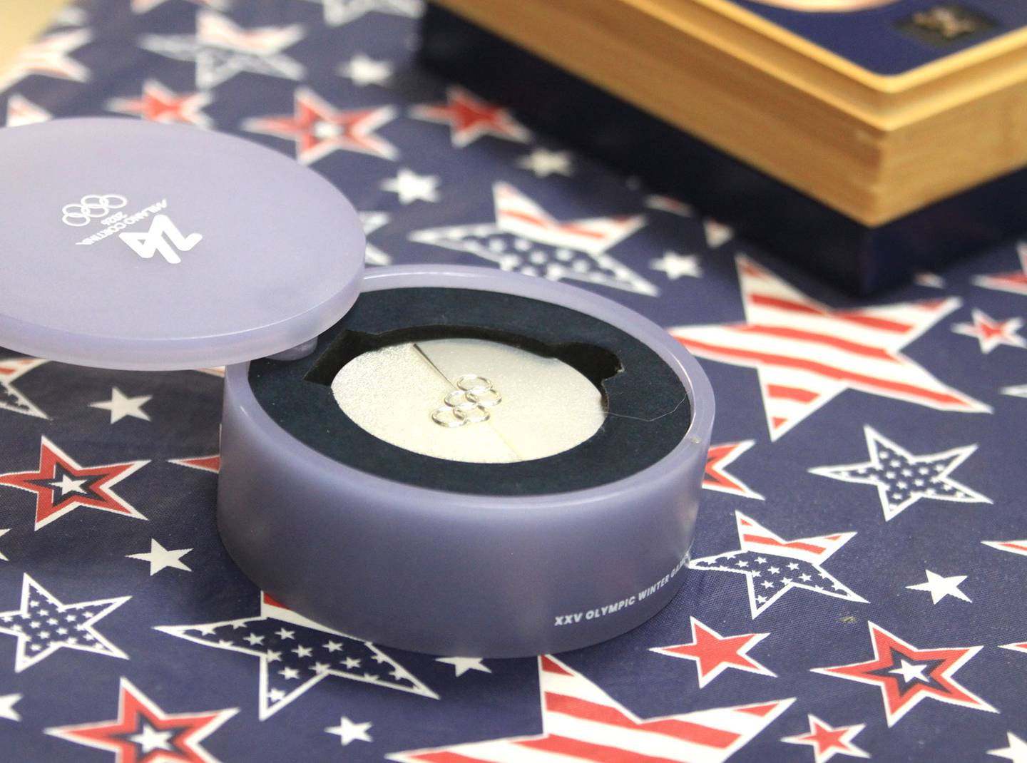 Olympic medals earned by speed skater Ethan Cepuran are displayed during a reception at the Glen Ellyn Historical Society.