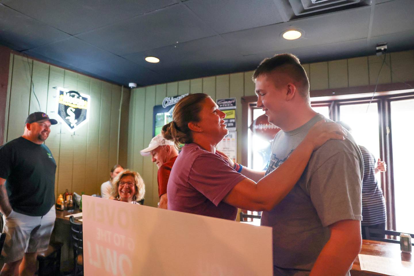Sarah Shoven, center, shares a moment with her son, Tyler, after being surprised with a trip to the Super Bowl by Make-A-Wish Illinois volunteers last week as his dad, Jason, left, looks on as the family dined at Sammy's Pizza in Bourbonnais.
The 2025 Clifton Central graduate will celebrate the third anniversary of his heart transplant in February along with traveling to California for the big game.