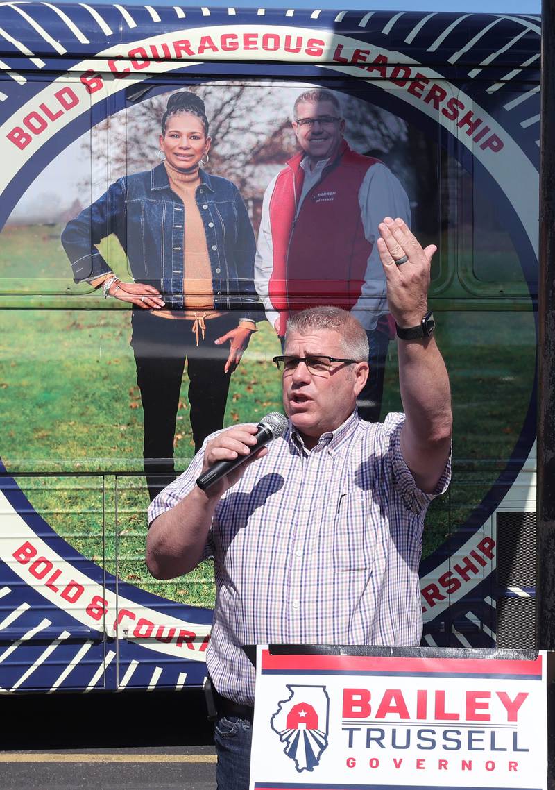 Darren Bailey, a Republican candidate for Illinois governor, speaks in front of his bus Friday, June 17, 2022, during his campaign stop at Tom and Jerry's in Sycamore. Bailey is currently on a bus tour across the state that will cover 102 countys in 14 days.
