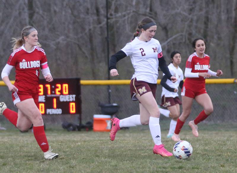 Morris's Ella McDonnell splits Streator defenders Josie Goerne and Ophelia Orozco to score the teams first goal on Monday, March 25, 2024 at the James Street Recreation Area in Streator.
