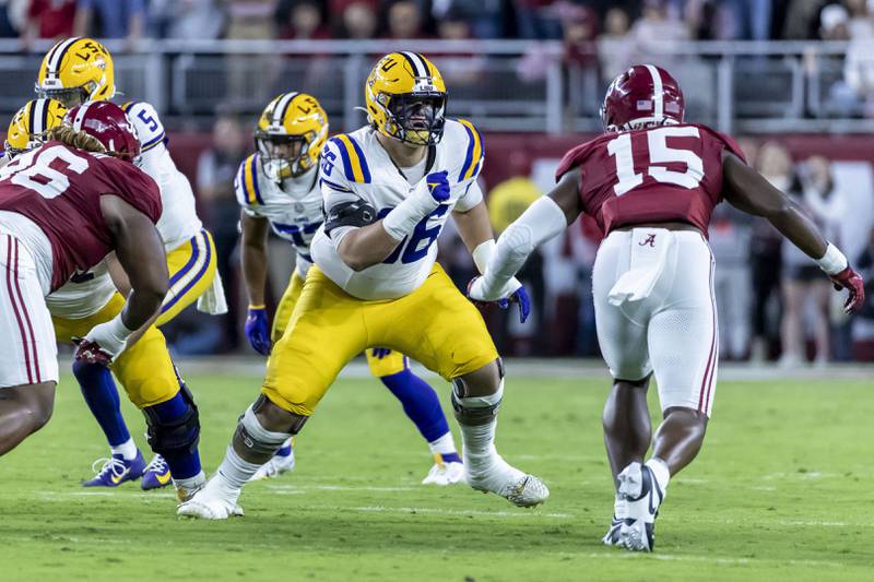 LSU offensive lineman Will Campbell (66) faces off against Alabama linebacker Dallas Turner (15) during the first half of an NCAA college football game, Saturday, Nov. 4, 2023, in Tuscaloosa, Ala. (AP Photo/Vasha Hunt, File)