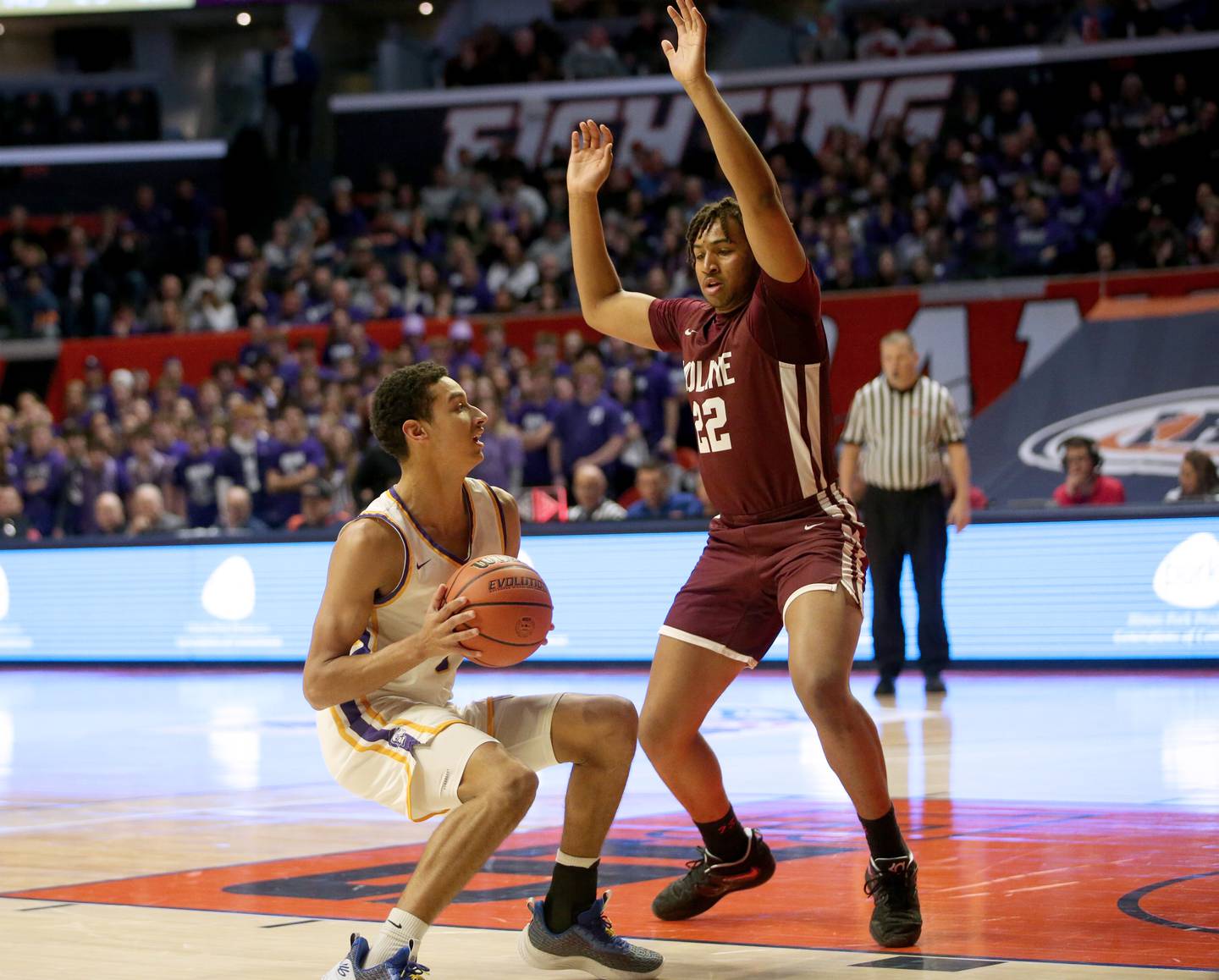 Downers Grove North's Jacob Bozeman is stopped in the lane by Moline's Treyvon Taylor during the Class 4A state semifinal game on Friday, March 10, 2023 in Champaign.