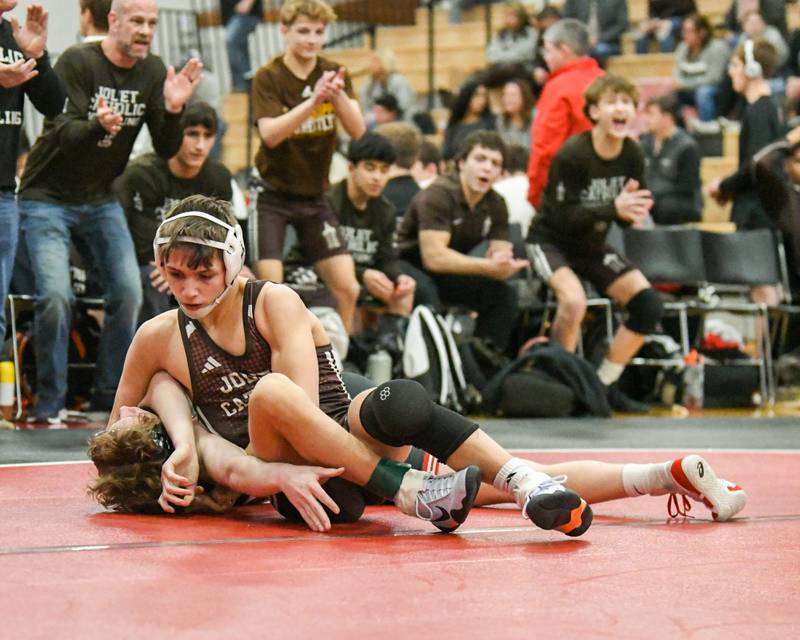 Matthew Lair, right, of Joliet Catholic Academy pins Nathan Craft of Yorkville during the regional meet in the 126-weight class on Tuesday Feb. 25, 2025, held at Yorkville High School.