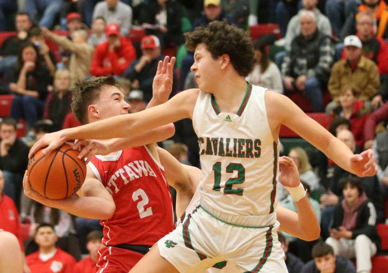 Ottawa's Huston Hart has his shot blocked by L-P's Michael Hartman on Friday, Jan. 5, 2023 at Sellett Gymnasium.