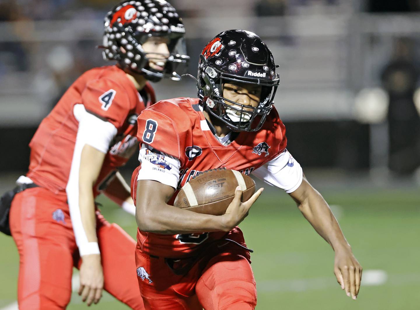 Glenbard East's Kedrick Dennis (8) runs the ball during the varsity football game between Riverside Brookfield and Glenbard East on Friday, Oct. 24, 2025 in Lombard, IL.