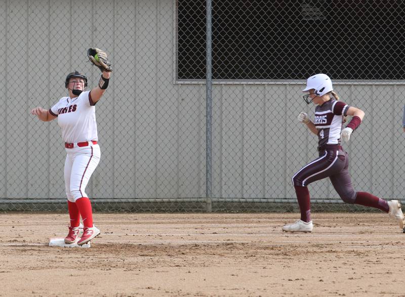 Ottawa's Peyton Bryson makes a catch at first base to force out Morris's Karson Dransfeldt on Monday, May 15, 2023 at Ottawa High School.