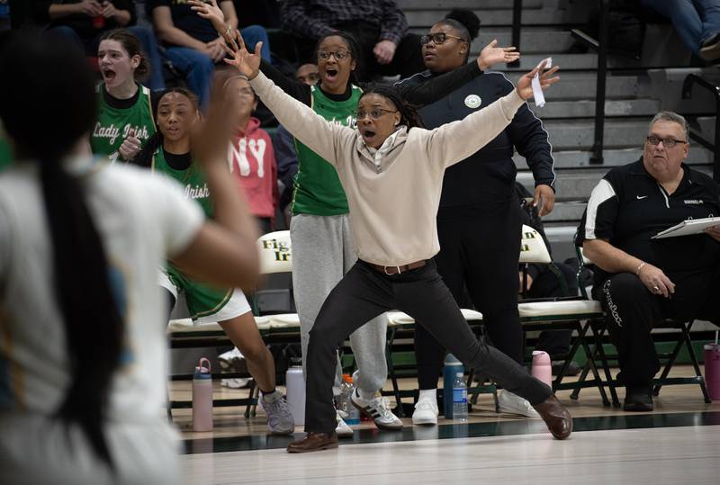 Bishop McNamara's head coach Khadaizha Sanders, center, reacts to a call on the floor during the Class 2A Regional Championship against Joliet Catholic on Thursday, Feb. 19, 2026.