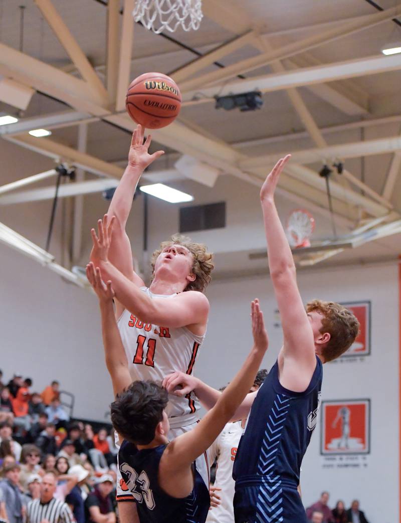 Wheaton Warrenville South's Colin Moore (11) takes a shot against Lake Park during a game on Saturday, Jan. 7, 2023.