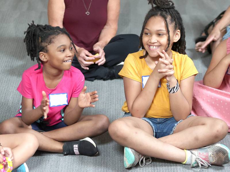 Janae Taylor, (left) 4, from DeKalb, and her sister Jameya, 7, have some fun Monday, July 11, 2022, during of a session of Summer Reading Vacation put on by Neighbors' House in DeKalb in conjunction with the DeKalb County Farm Bureau. Christ Community Church is hosting the camp this week in their outreach center on North 6th Street in DeKalb.