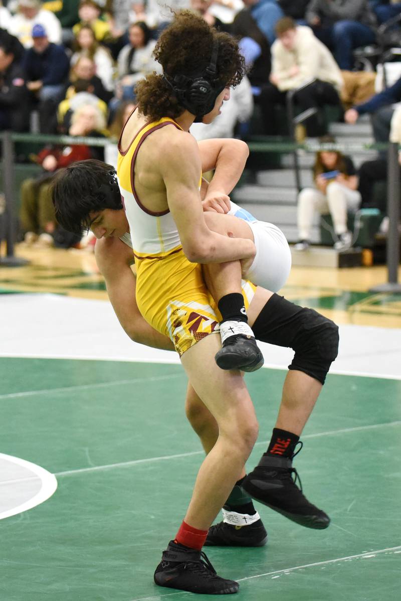 Westmont's Christian Rosa, gold, looks to counter a takedown attempt from Nazareth Academy's Alek Ramos during the 126-pound third-place match at the IHSA Class 1A Coal City Sectional Saturday, Feb. 15, 2025.