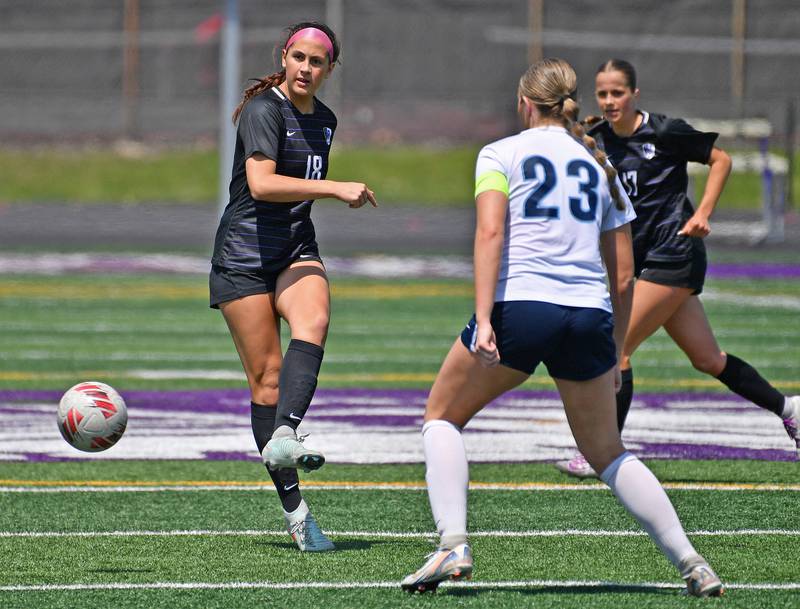 Downers Grove North’s Campbell Thulin (left) takes a shot at the goal during a game against Downers Grove South on May 10, 2025 at Downers Grove North High School in Downers Grove .