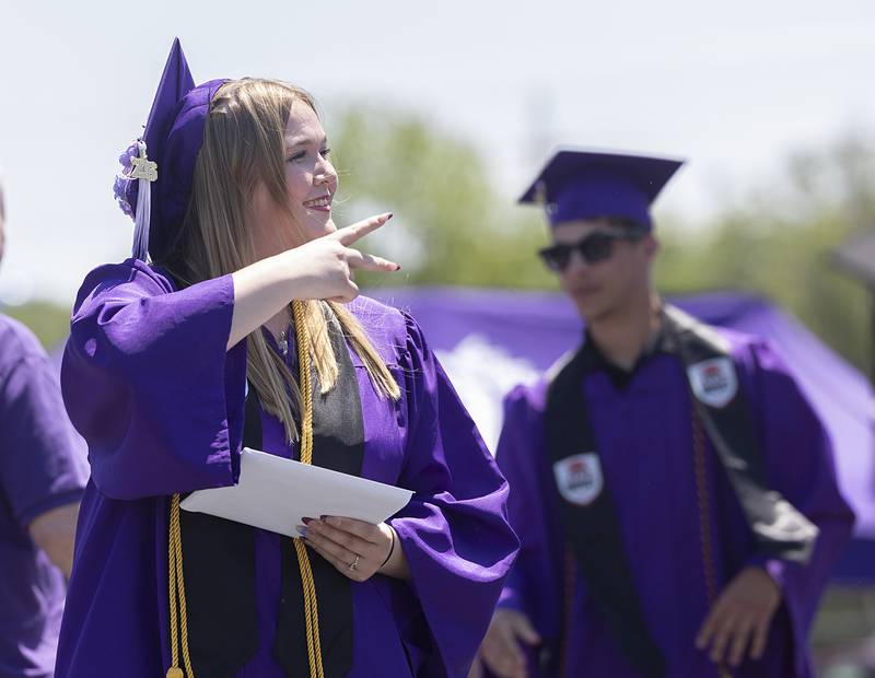Madolynn Kirby reacts to the crowd Sunday, May 24, 2026, after receiving her diploma from Dixon High School.