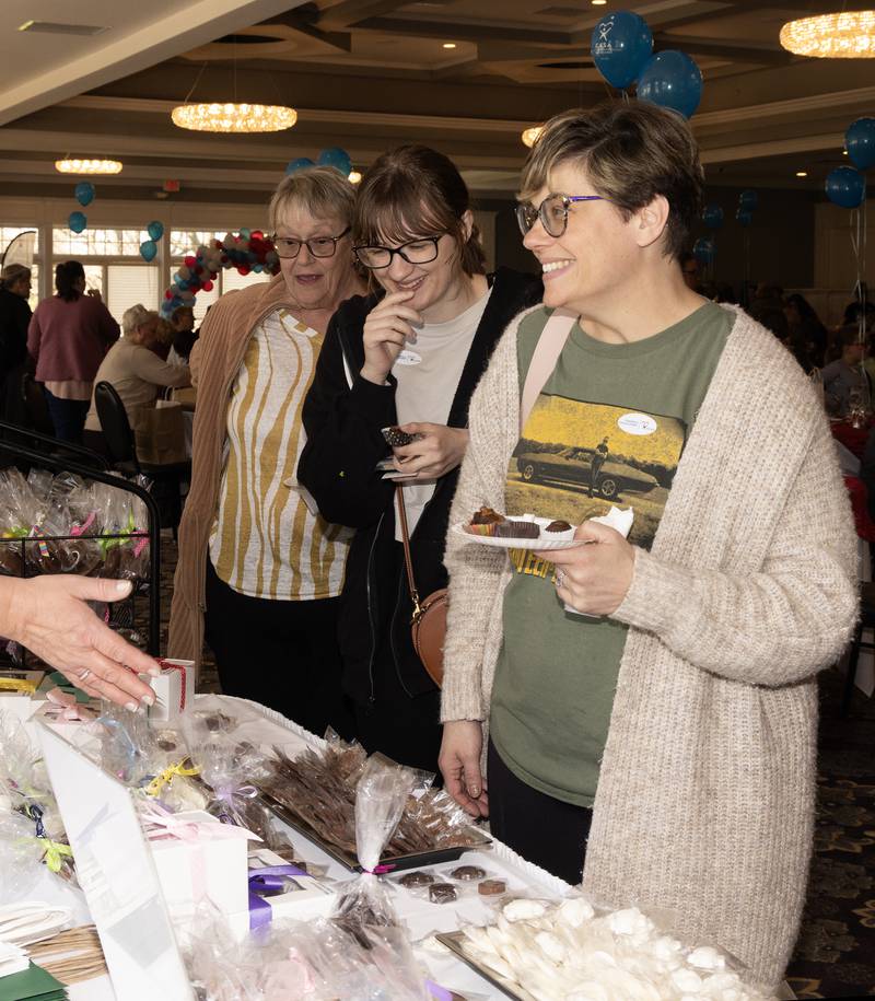 Three generations enjoyed Sunday's Chocolate Festival benefitting La Salle County CASA. Kathy Piacenti, her granddaughter Anna Argubright and daughter Marie Argubright, all of Spring Valley, stop by the Sullivan's Sweets table.