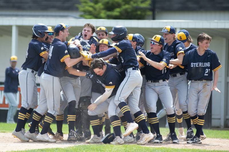 Sterling celebrates Blake Nettleton’s two-run homer against Dixon on Saturday, May 28, 2022 to put the Warriors up 3-1.