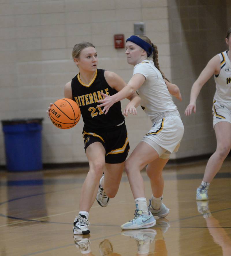 Riverdale's Cayleigh Hungate looks to pass as Polo's Camrynn Jones defends on Saturday, Jan. 18, 2025 at Polo High School.