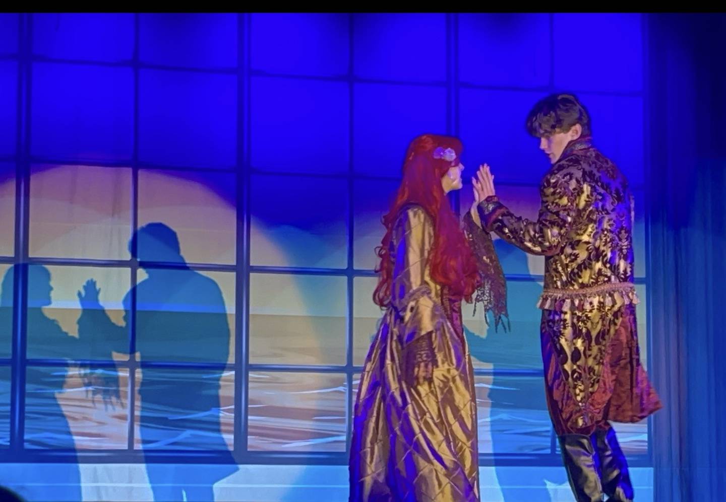 Ariel and Prince Eric perform together during the Morris Community High School's performance of "The Little Mermaid."