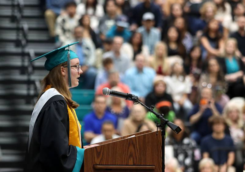 Liberty Johnson offers a salutatory address during graduation at Woodstock North High School in Woodstock on Saturday, May 17, 2025.