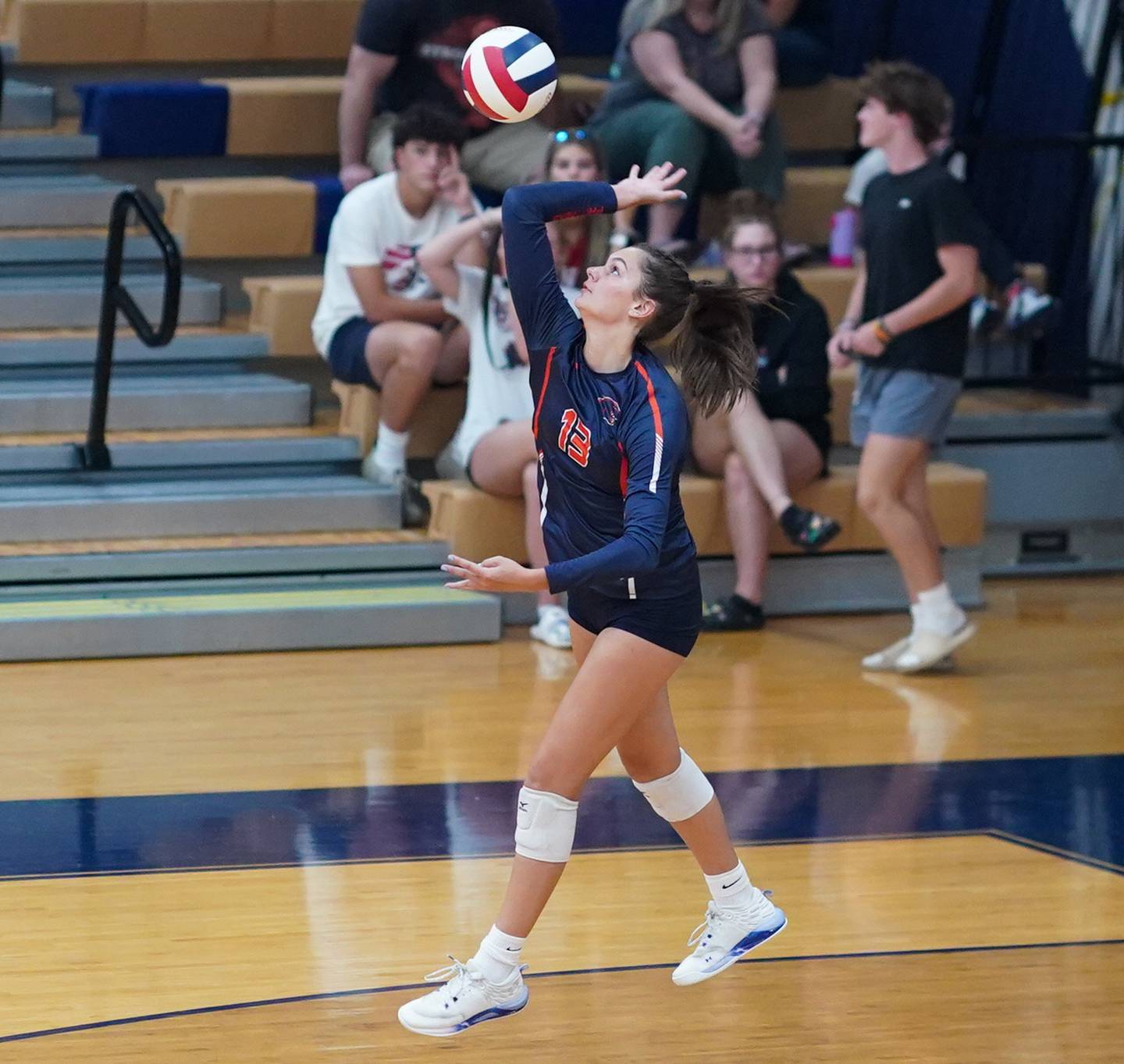 Oswego’s Sidney Hamaker (13) serves the ball against Rosary during a volleyball match at Oswego High School on Tuesday, Aug 29, 2023.