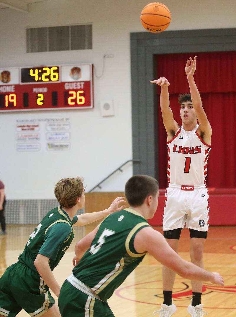 LaMoille's Tyler Billhorn lets go of a wide-open shot over St. Bede's Kaden Nauman and Halden Hueneburg on Tuesday, Feb. 11, 2025 at LaMoille High School.