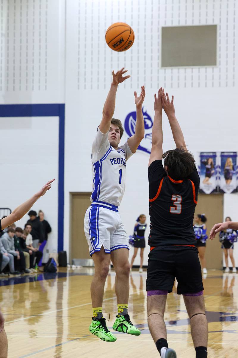 Peotone's Alex Chenoweth shoots over Beecher's Kyle Kasput during the Blue Devils' 64-52 victory over Beecher on Wednesday, Jan. 28, 2026.