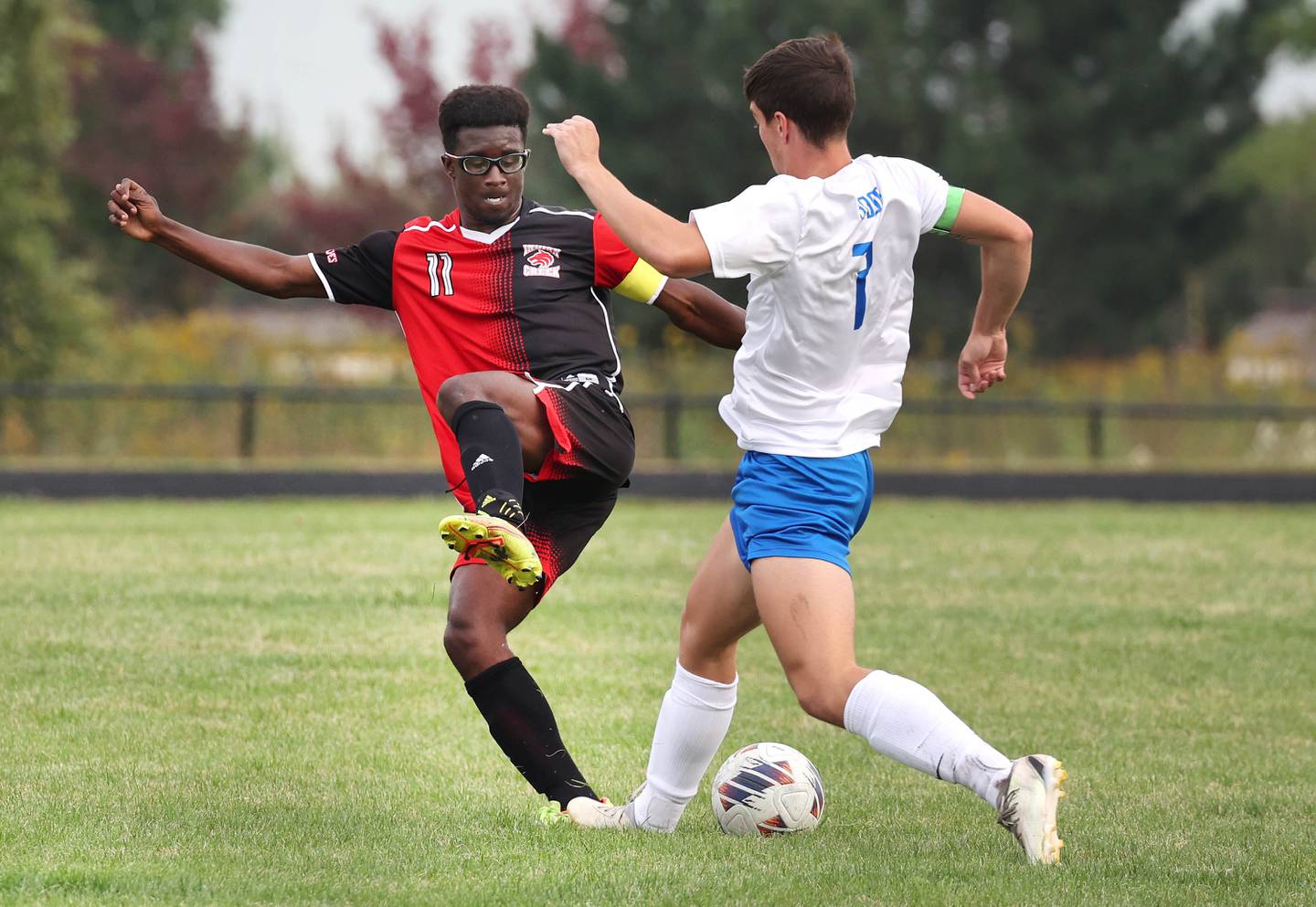 Indian Creek's Cayden Gaston (left) and Hinckley-Big Rock's Landon Roop fight for possession during their game Wednesday, Sept. 20, 2023, at Pack Park in Waterman.