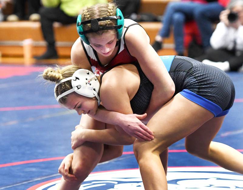 Newman's Blair Grennan grabs the legs of Erie's Rozlyn Mosher in the 110-pound championship match at the Belvidere Regional on Saturday, Feb. 7, 2026.