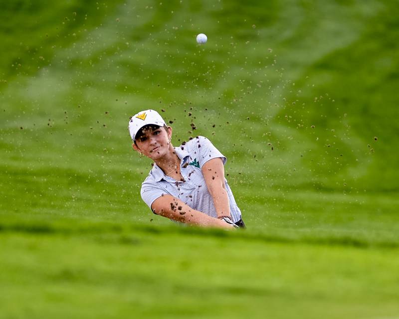Neuqua Valley Meadow Rolence hits out of the sand trap during the regional tournament held at Whitetail ridge in Yorkville on Thursday Sep. 28, 2023.