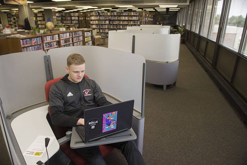 Craig Jamieson, a student/basketball player from Switzerland, tries out one of the new study pods at Sauk Valley College's library Wednesday, April 20, 2022. The school used COVID relief funds to purchased the pods.